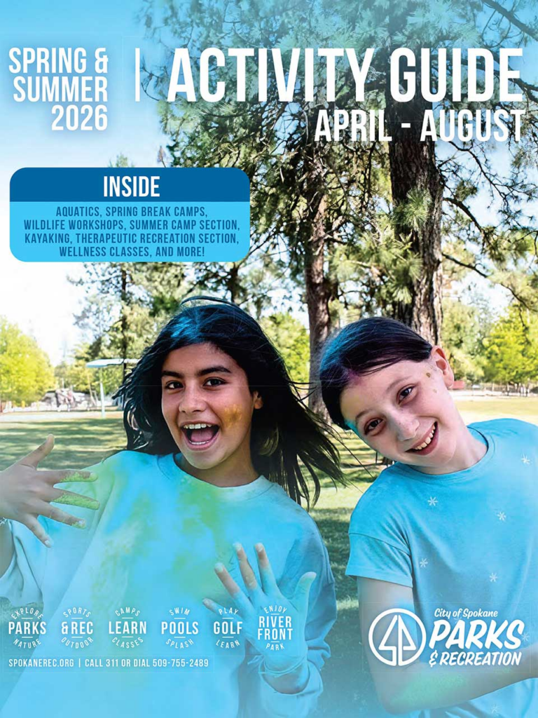 Cover of the spring and summer Spokane Parks Activity Guide. Two youth doing face painting and smiling.